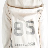 White hoodie worn by a person, showing the hoodie's fit