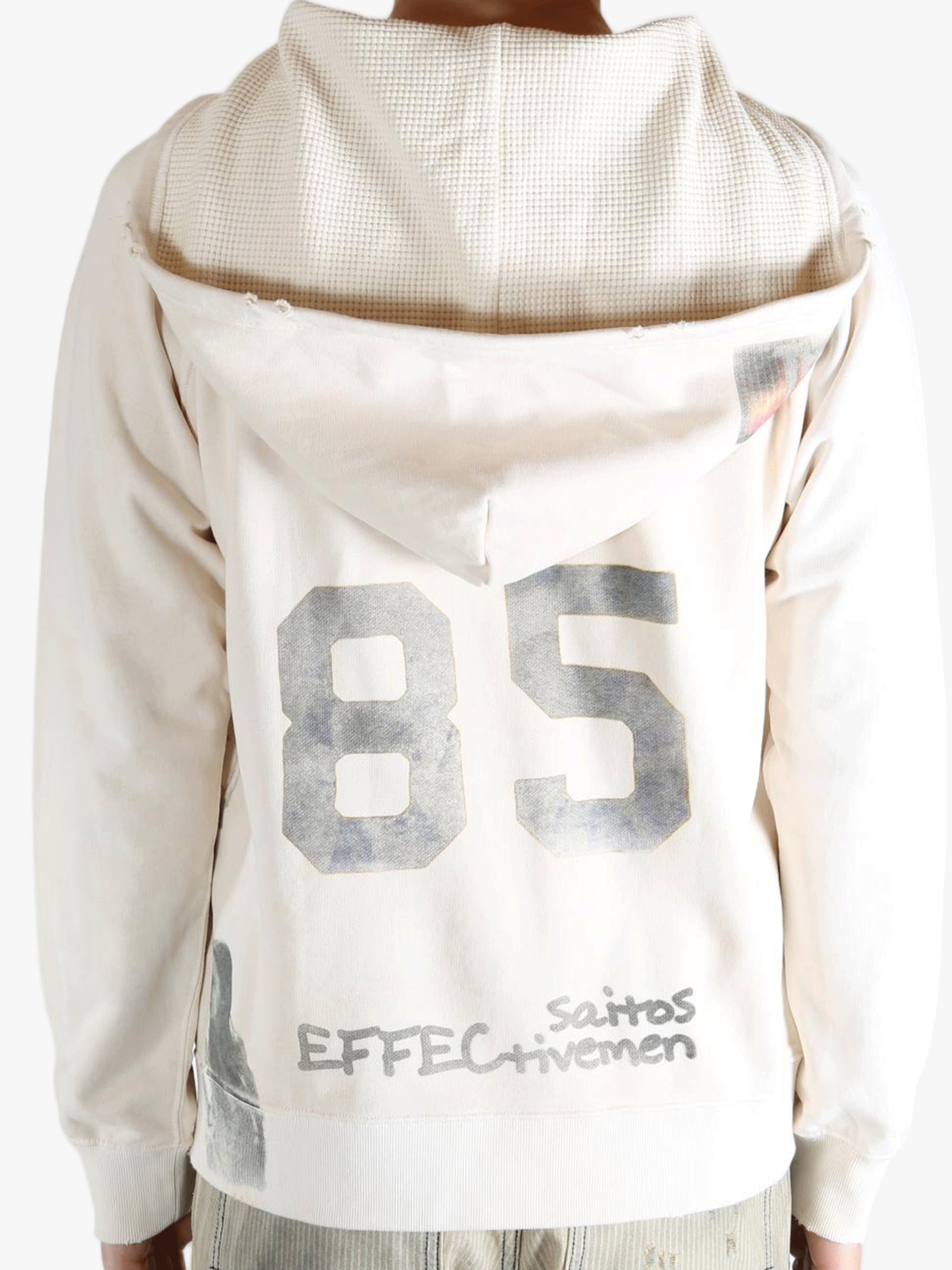 White hoodie worn by a person, showing the hoodie's fit