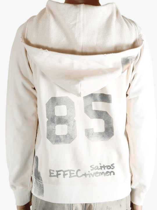 White hoodie worn by a person, showing the hoodie's fit