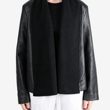 Black jacket worn by a person, showing the jacket fit