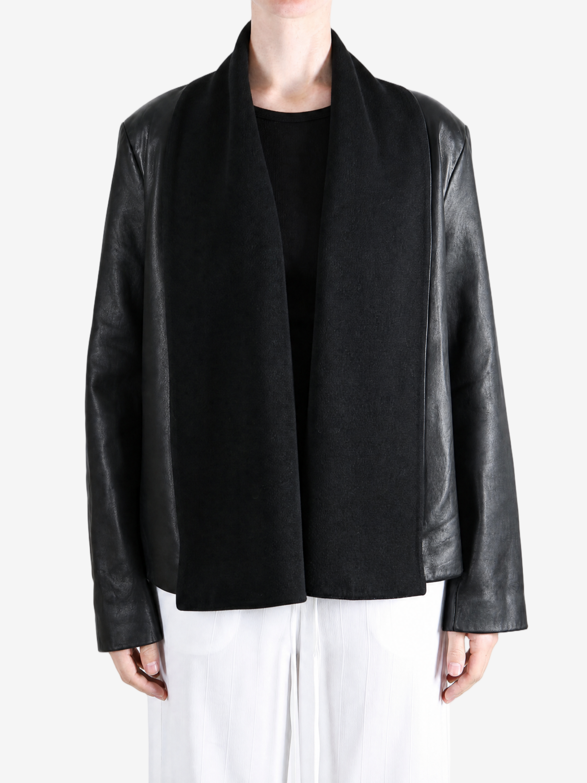 Black jacket worn by a person, showing the jacket fit