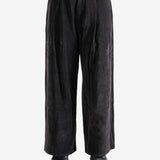 Brown pants worn by a person, showing the pants' fit