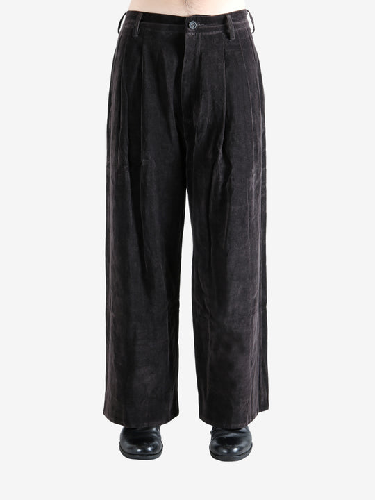 Brown pants worn by a person, showing the pants' fit