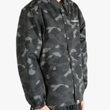 Black jacket worn by a person, showing the jacket's fit