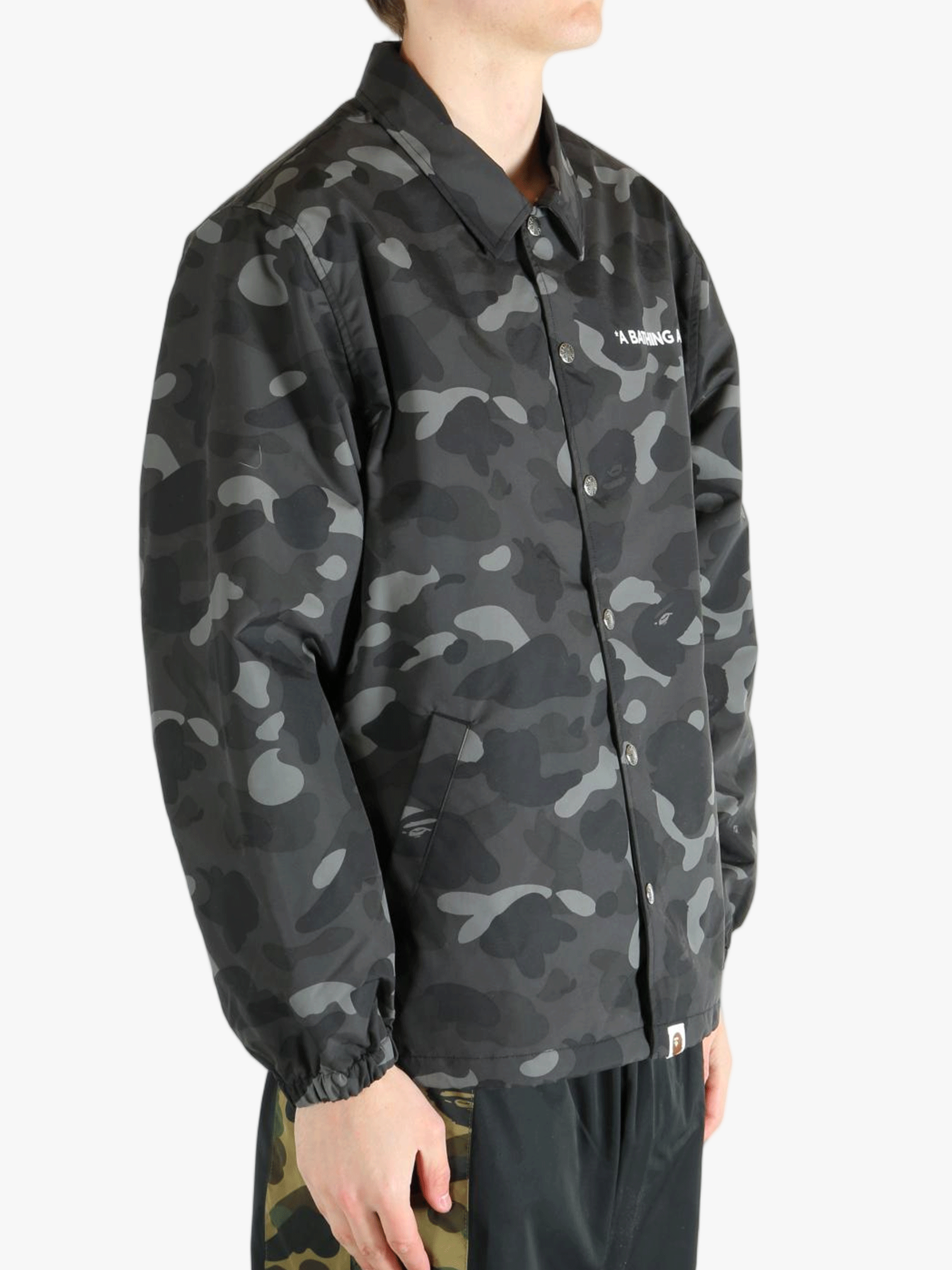 Black jacket worn by a person, showing the jacket's fit