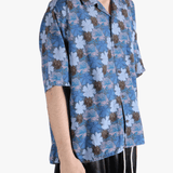 Navy shirt worn by a person, showing the shirt's fit