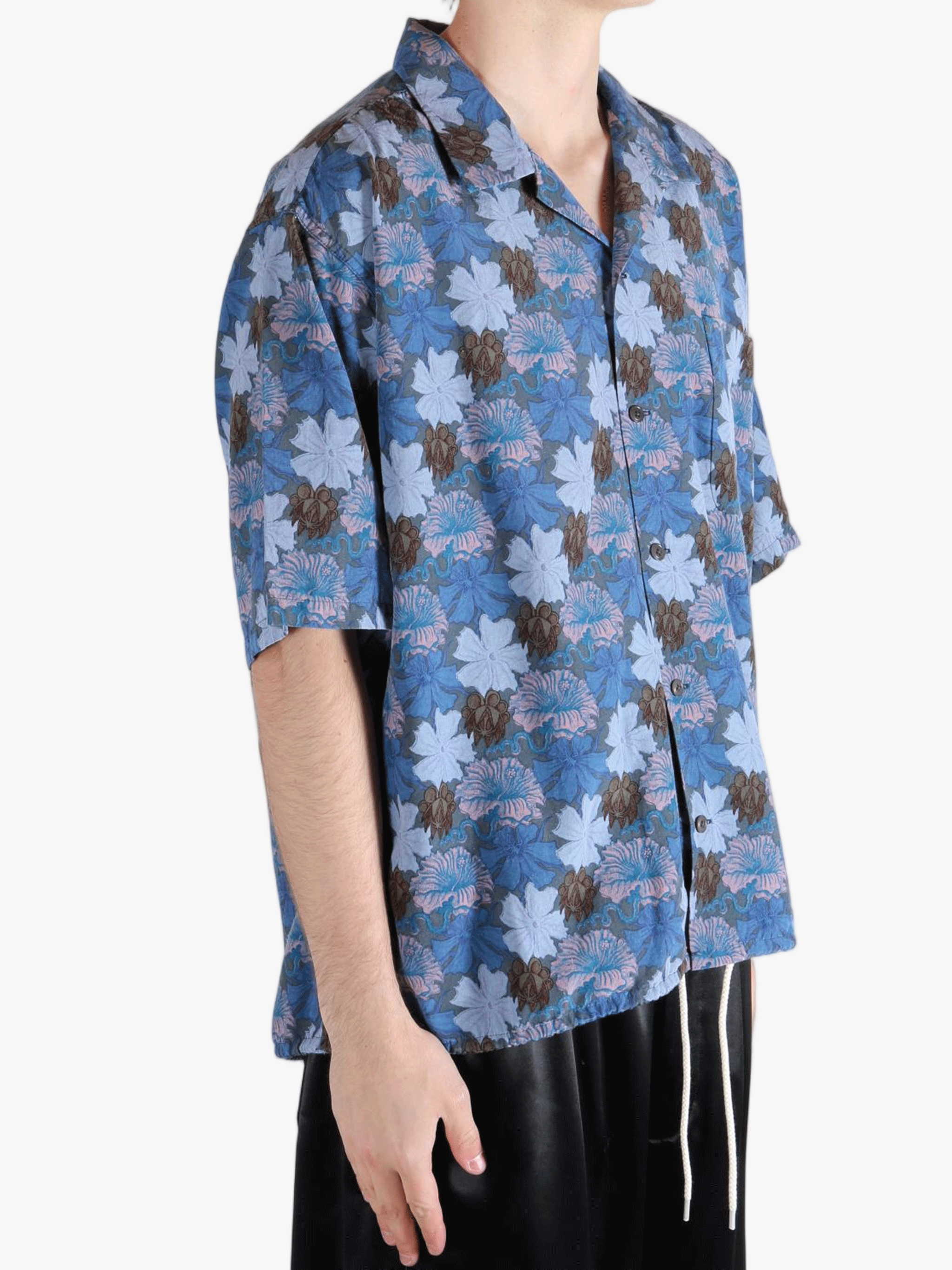 Navy shirt worn by a person, showing the shirt's fit