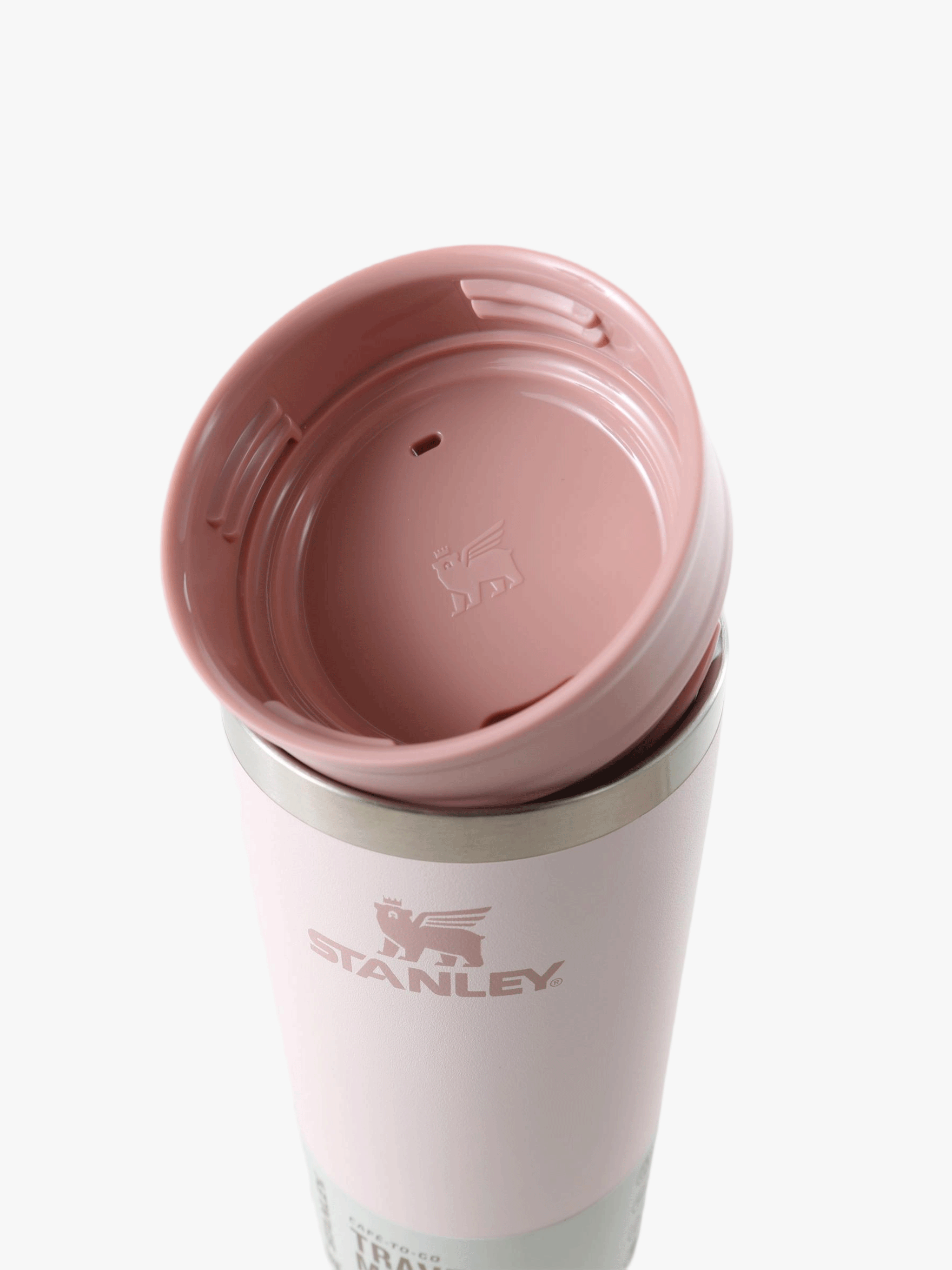 Close up of pink cup, showing the detail of the lid