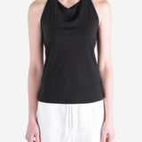 BLack tops worn a person,showing the tops fit