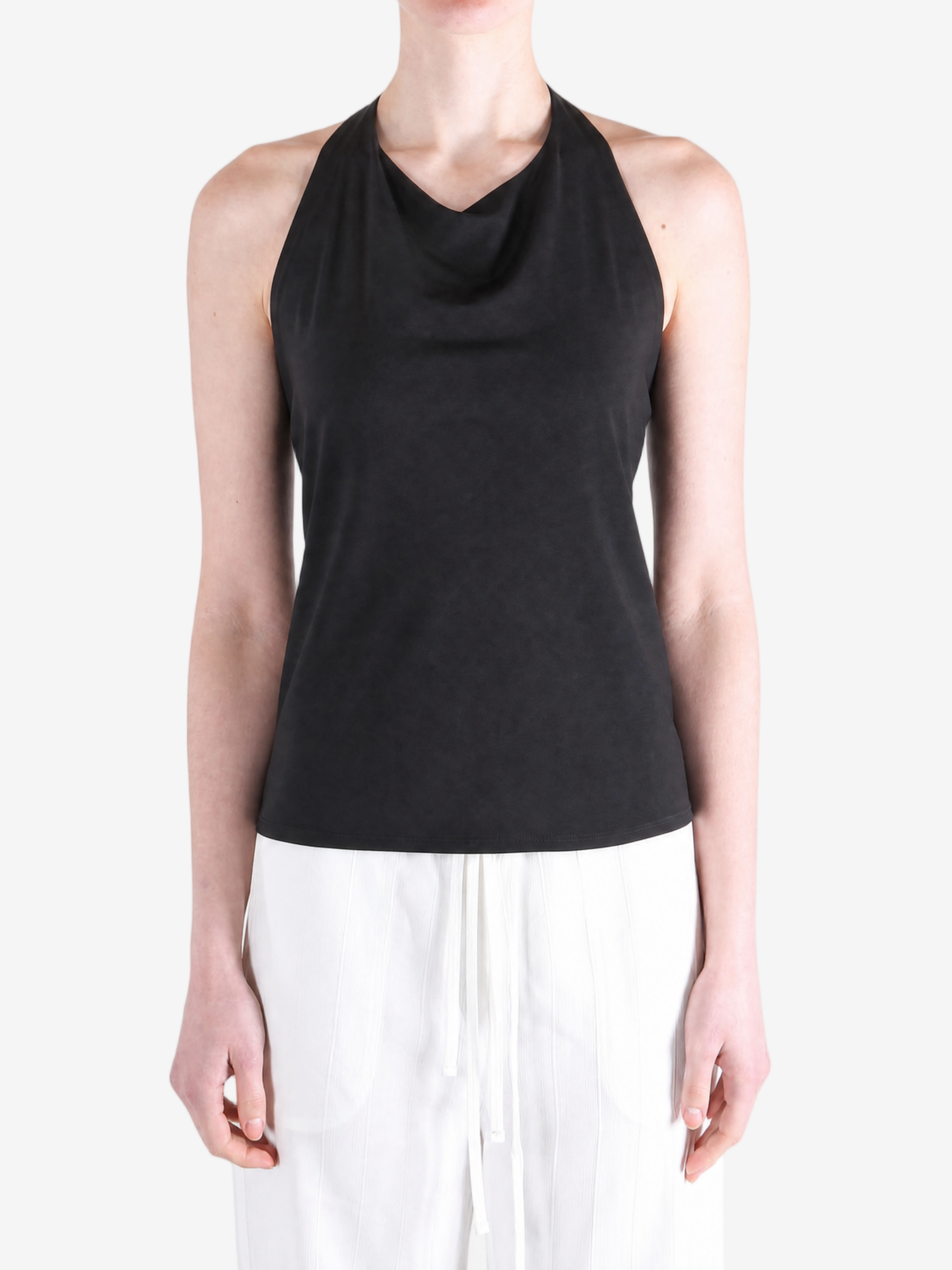 BLack tops worn a person,showing the tops fit