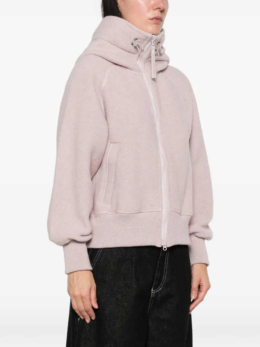 Pink jacket worn by a person, showing the jacket fit