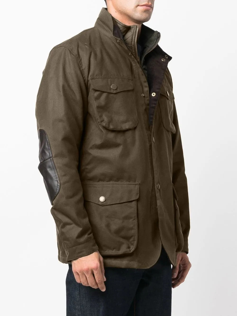 Green jacket worn by a person, showing the jacket fit