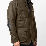 Green jacket worn by a person, showing the jacket fit