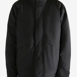 Black jacket worn by a person, showing the jacket's fit