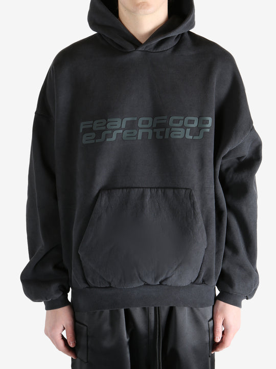 Black hoodie worn by a person, showing the hoodie's fit