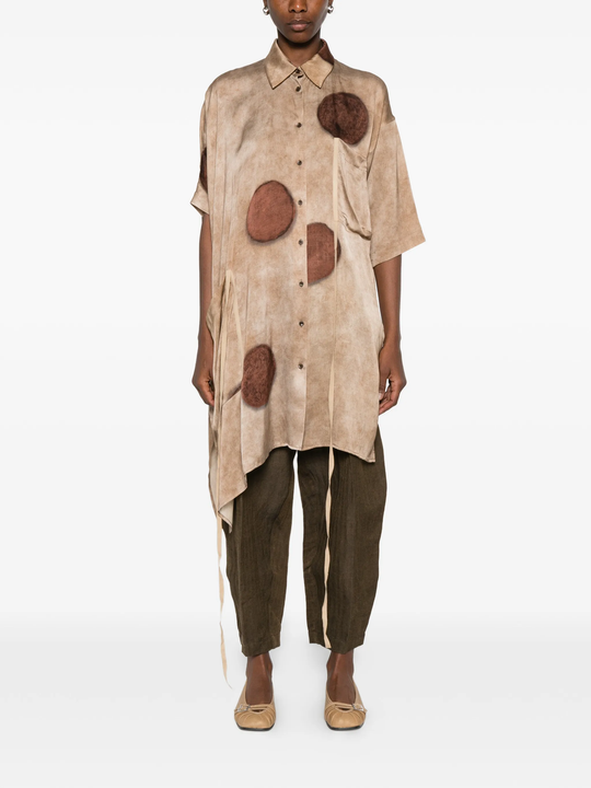Brown top worn by a person, showing the top's fit