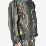 Grey jacket worn by a person, showing the jacket's fit