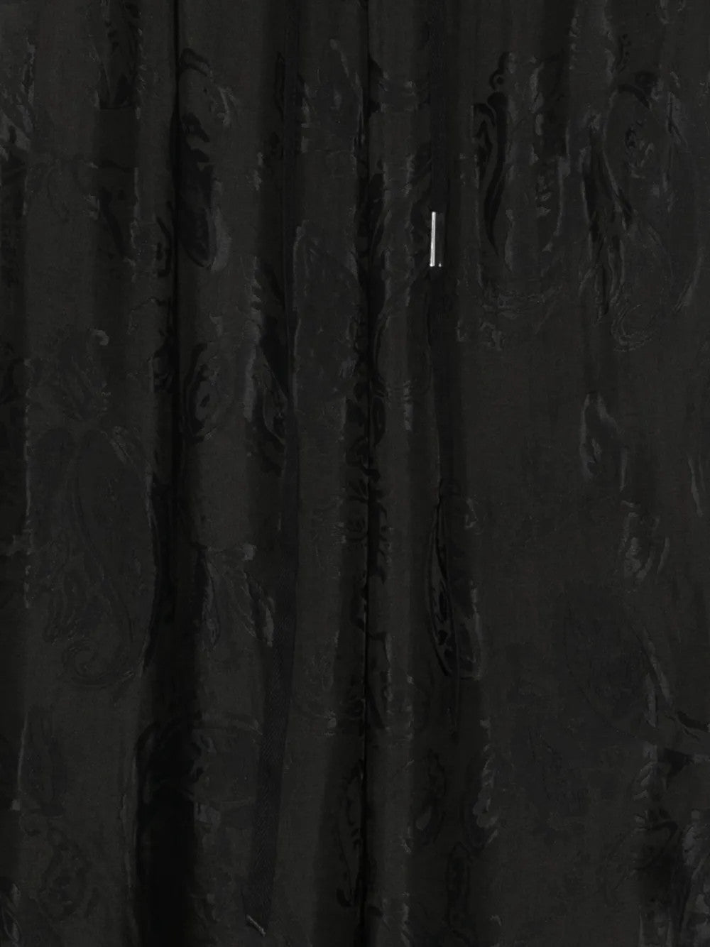 Close up of Black pants, showing texture of the 62% acetate/ 38% viscose fabric