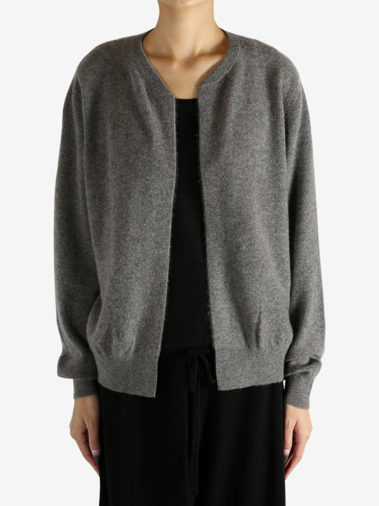 Grey knitwear worn by a person, showing the knitwear's fit