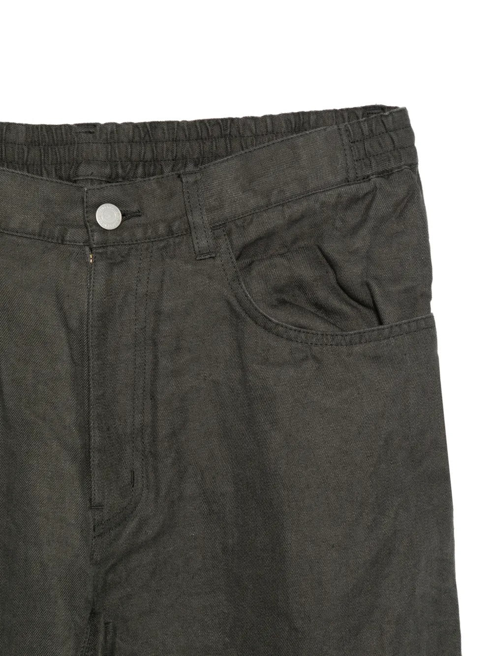 Close up of grey pants, showing texture of the cotton fabric