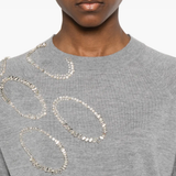 Close up of grey sweater, showing texture of the wool fabric