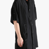 Black jacket worn by a person, showing the jacket's fit