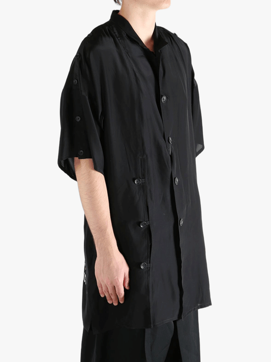 Black jacket worn by a person, showing the jacket's fit