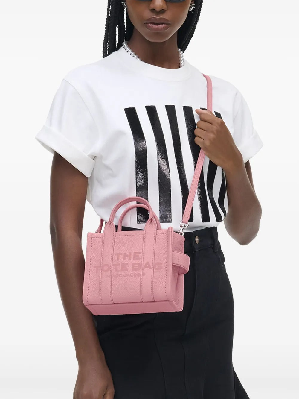 Pink bag worn by a person, showing the bag's fit