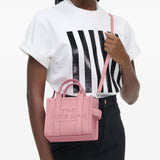 Pink bag worn by a person, showing the bag's fit