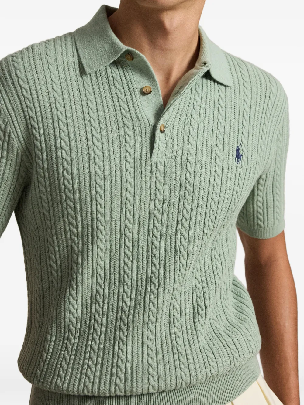 Green shirt worn by a person, showing the shirt fit