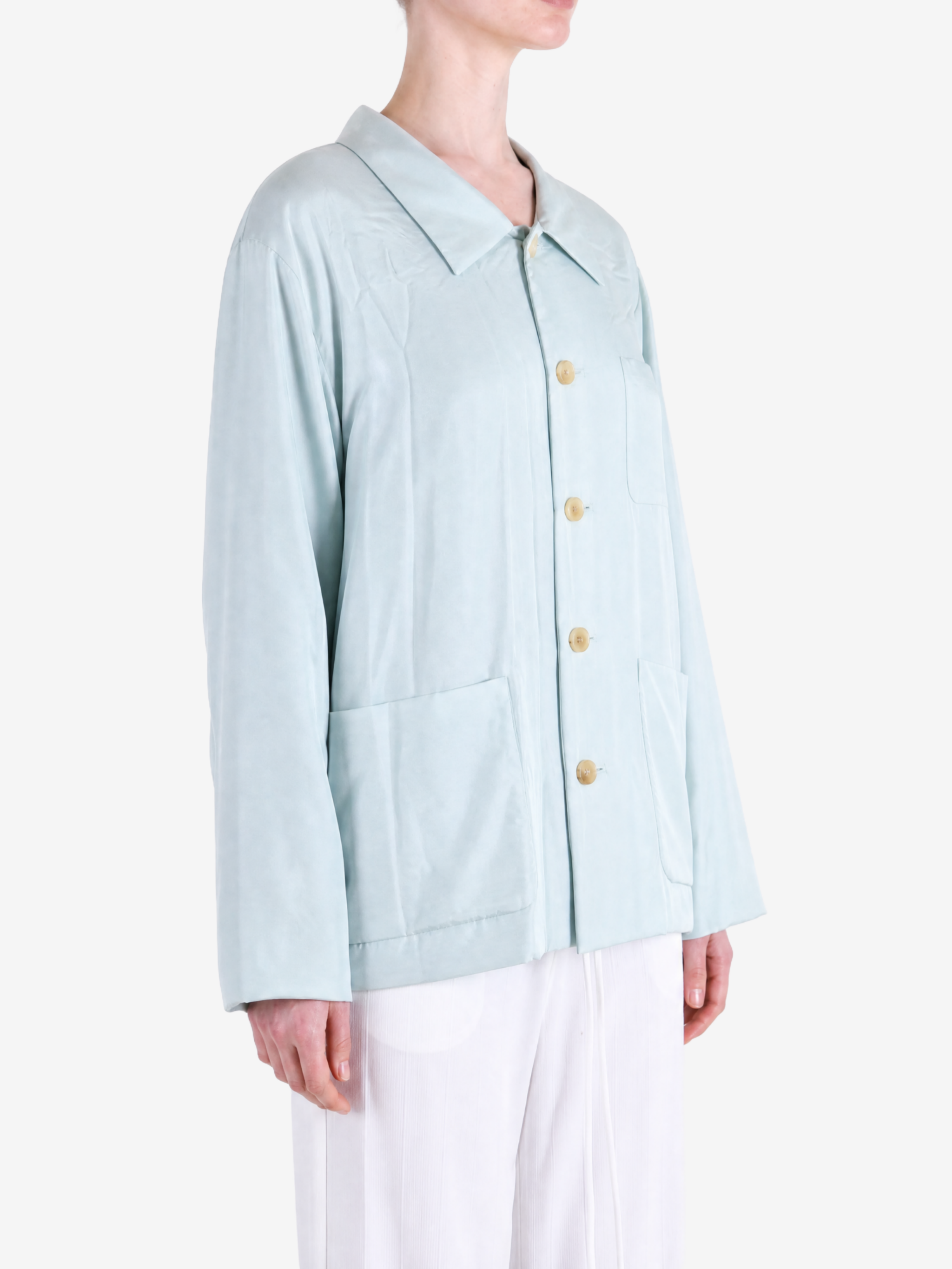 Blue jacket worn by a person, showing the jacket fit