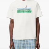 White t-shirt worn by a person, showing the white t-shirt's fit