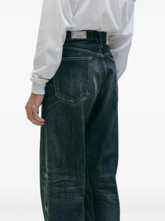 Blue pants worn by a person, showing the pants fit