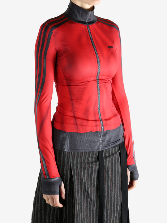 red jacket worn by a person, showing the jacket fit