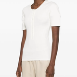 White shirt worn by a person, showing the shirt's fit