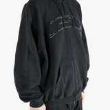 Black hoodie worn by a person, showing the hoodie fit