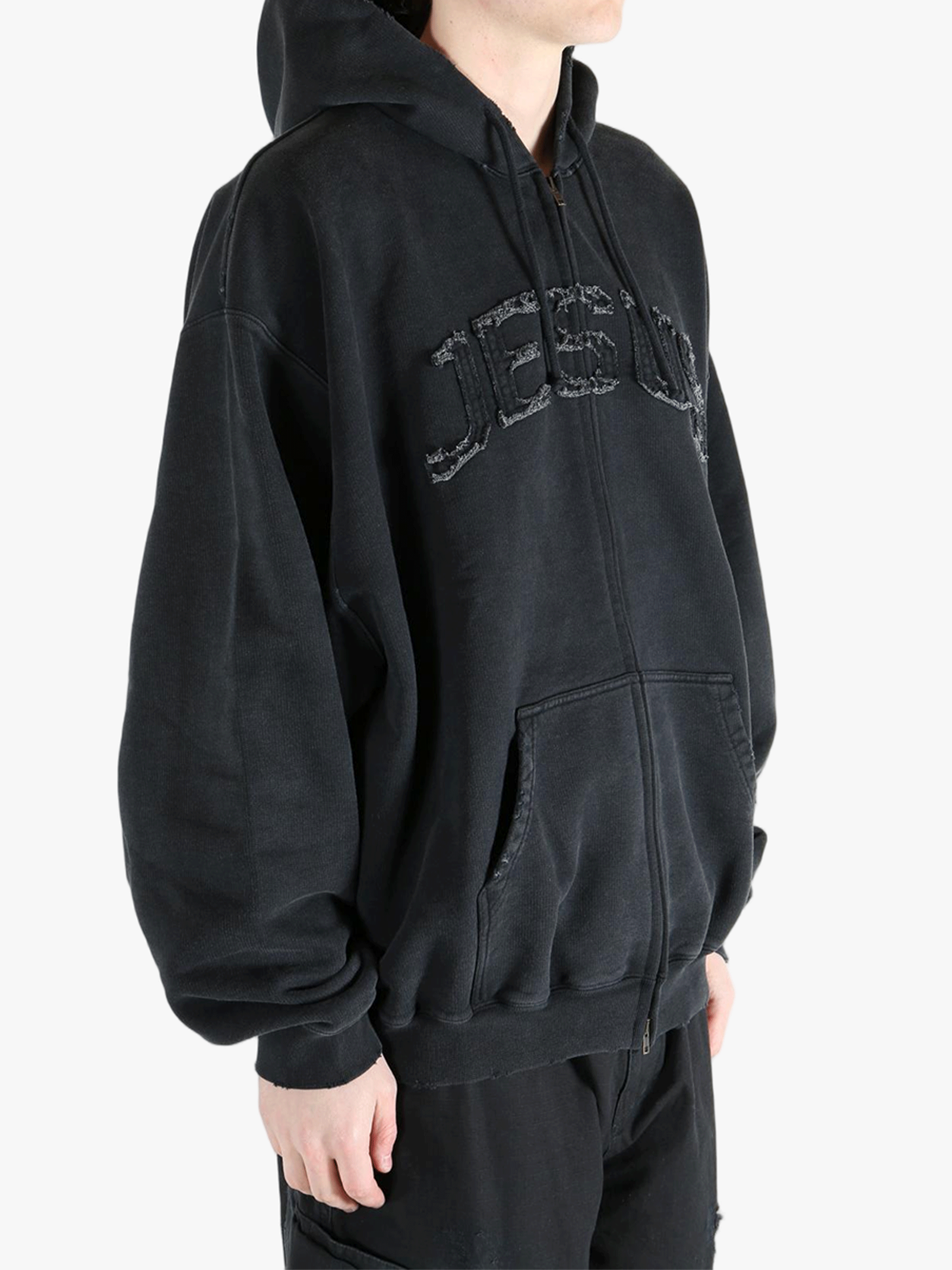 Black hoodie worn by a person, showing the hoodie fit