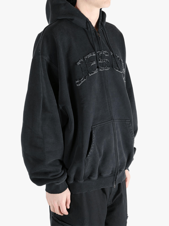 Black hoodie worn by a person, showing the hoodie fit