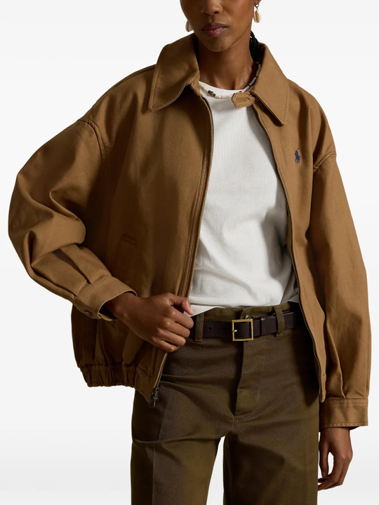 Brown jacket worn by a person, showing the jacket's fit