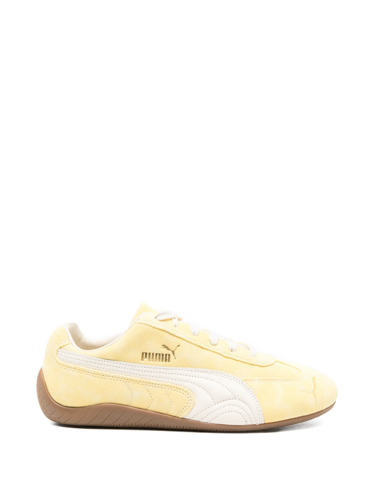 Yellow sneakers, front view