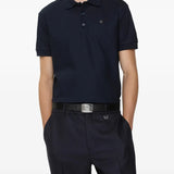 Navy polo worn by a person, showing the polo's fit