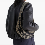 Black bag, worn by a person, showing the bag fit