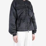 Black jacket worn by a person, showing the jacket fit