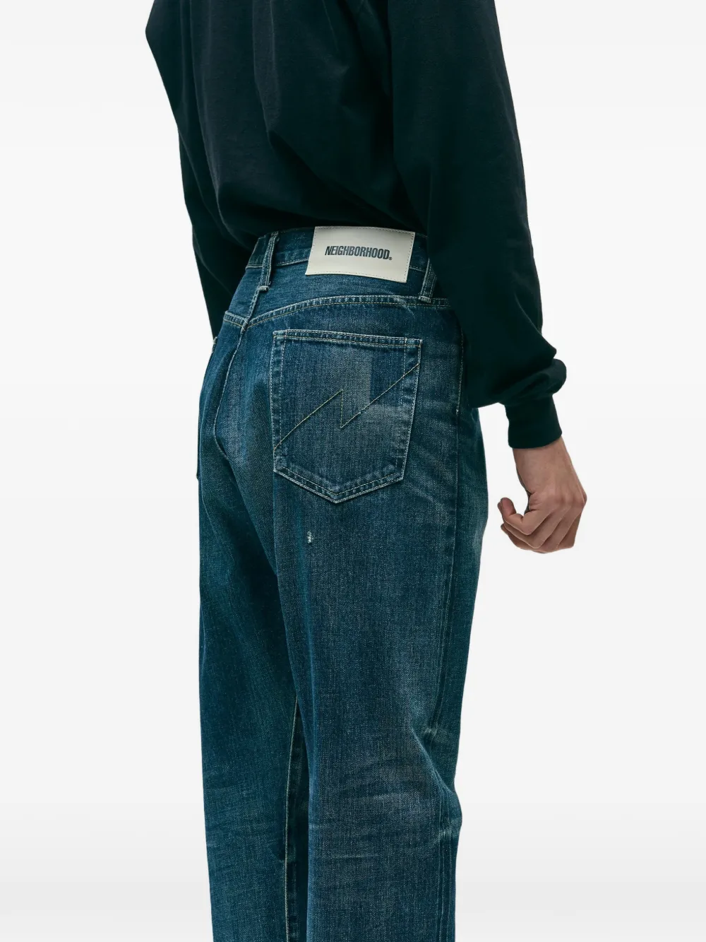 Blue pants worn by a person, showing the pants fit