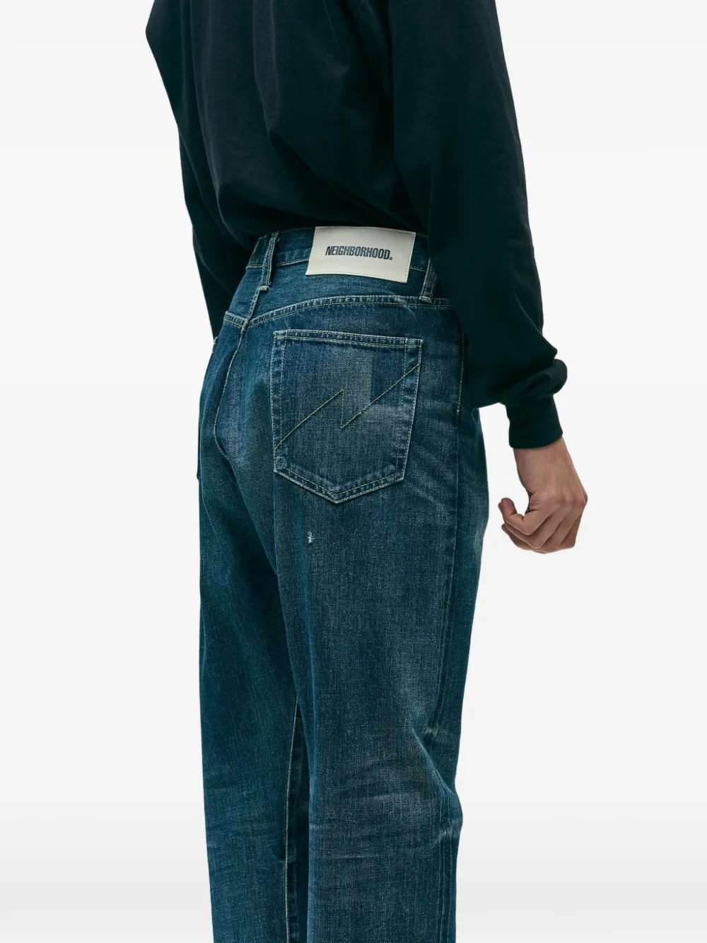 Blue pants worn by a person, showing the pants fit