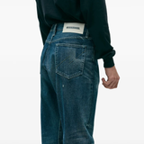 Blue pants worn by a person, showing the pants fit