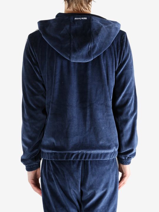 Navy hoodie worn by a person, showing the hoodie's fit