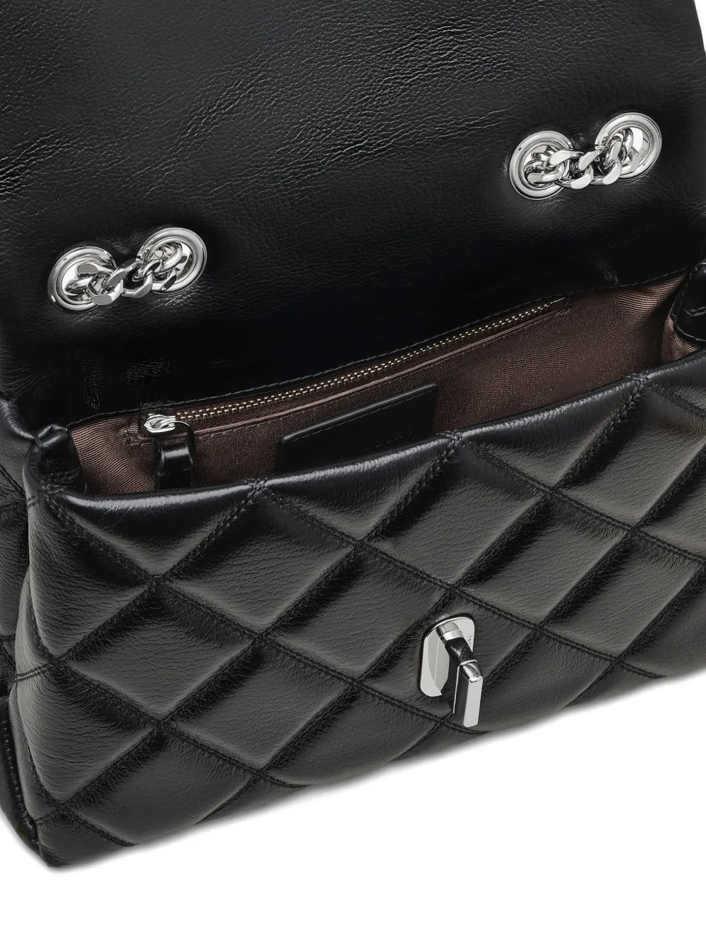 Close up of black bags, showing texture of the cow leather fabric