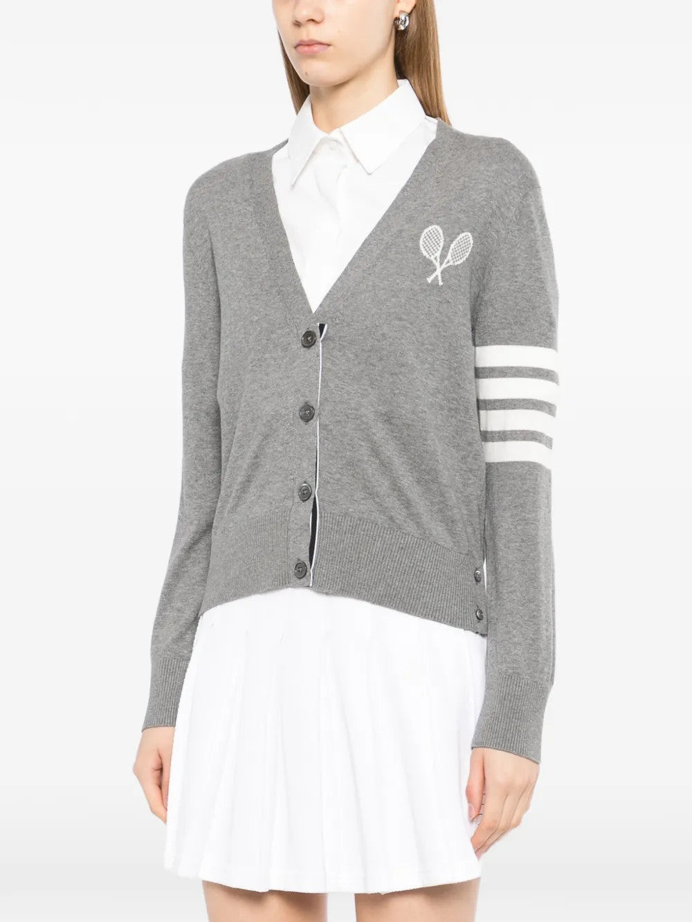 Grey knitwear worn by a person, showing the knitwear fit