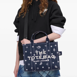 Navy bag worn by a person, showing the bag fit